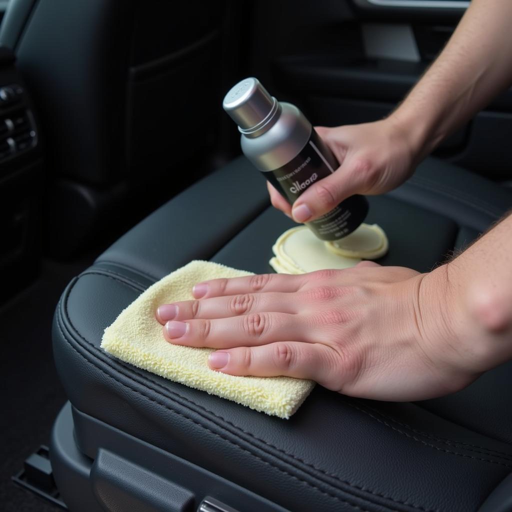 Applying leather conditioner to car seats