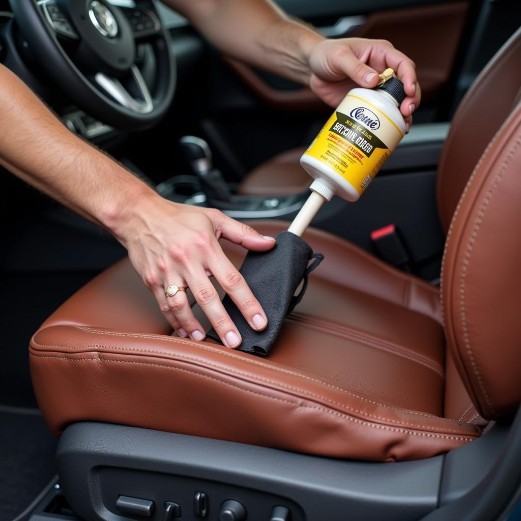 Applying leather conditioner to car seat