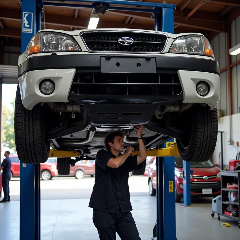 Car undergoing maintenance in a garage