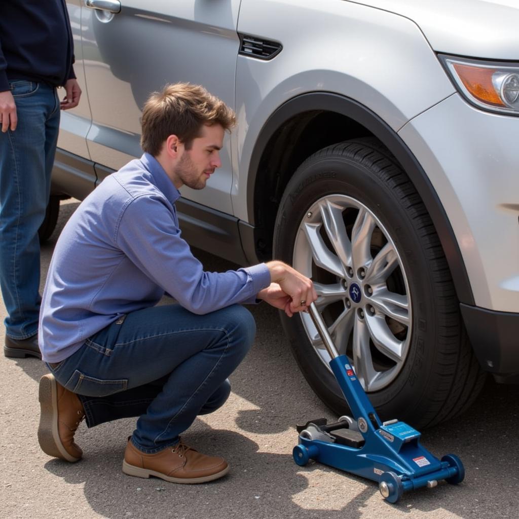 Changing a tire in a car maintenance class San Jose