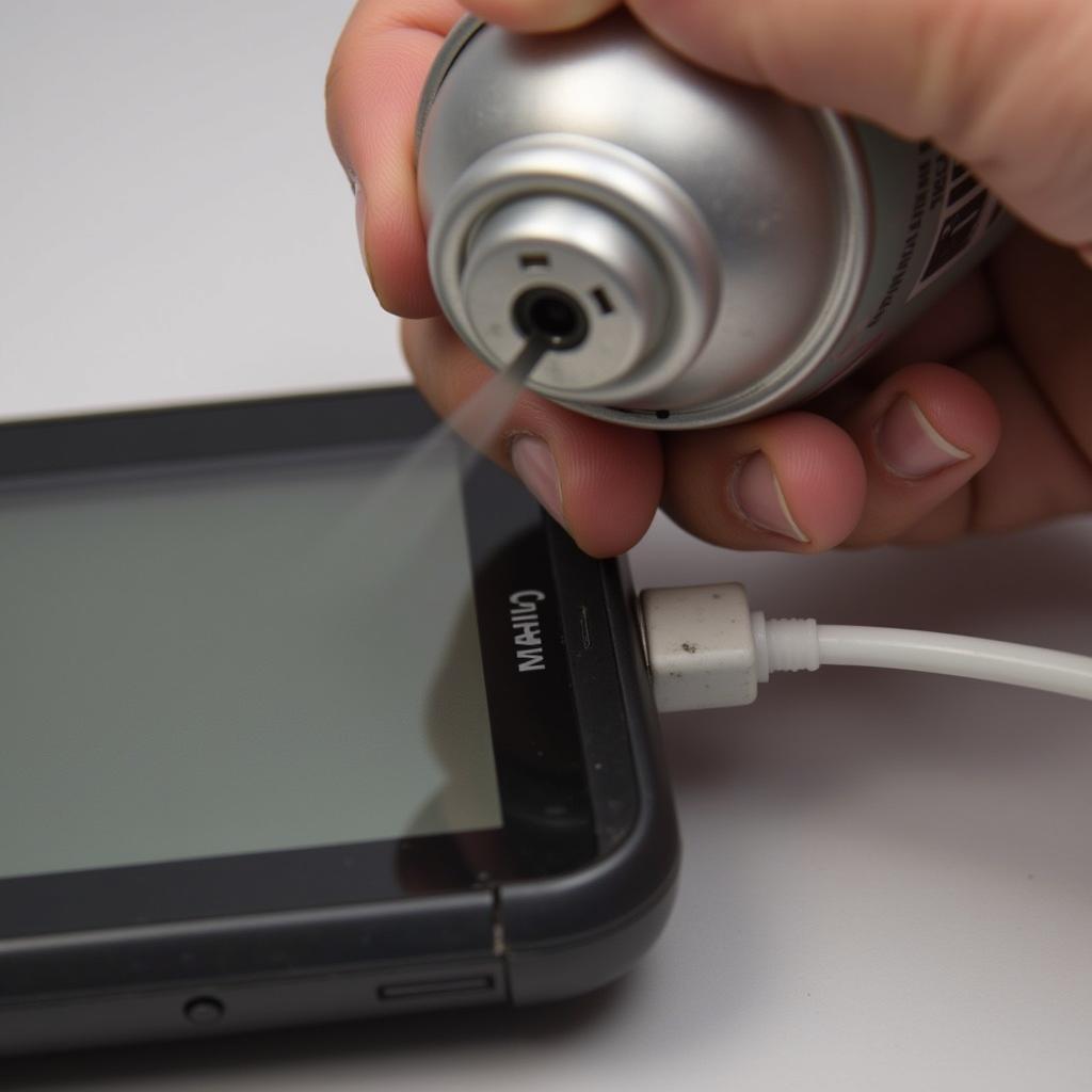 Cleaning the Garmin 61 LMT-S charging port with compressed air