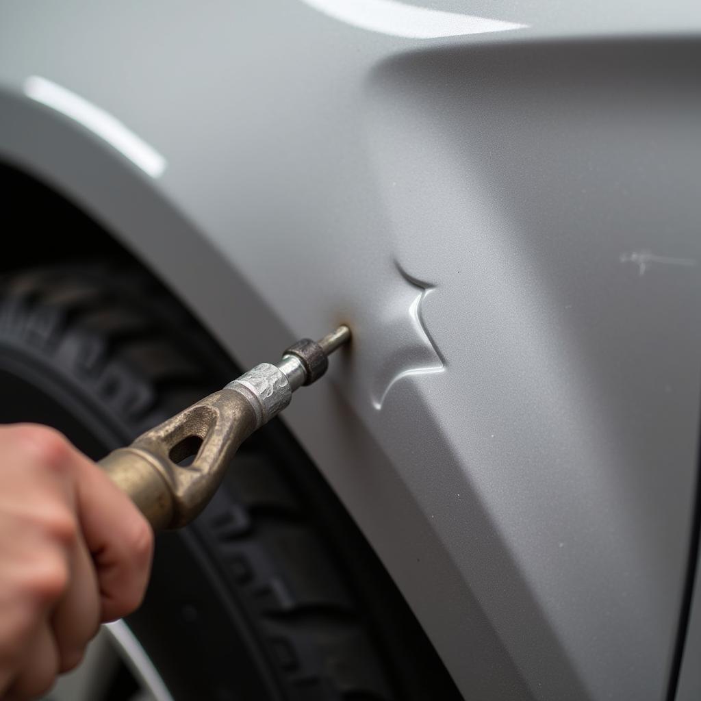 Paintless Dent Removal Process on Car Fender