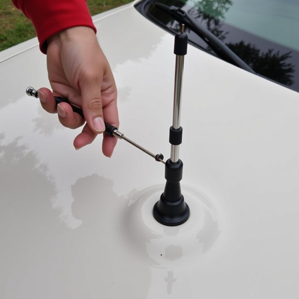 Inspecting the Antenna Mast on a 2003 Lincoln Town Car