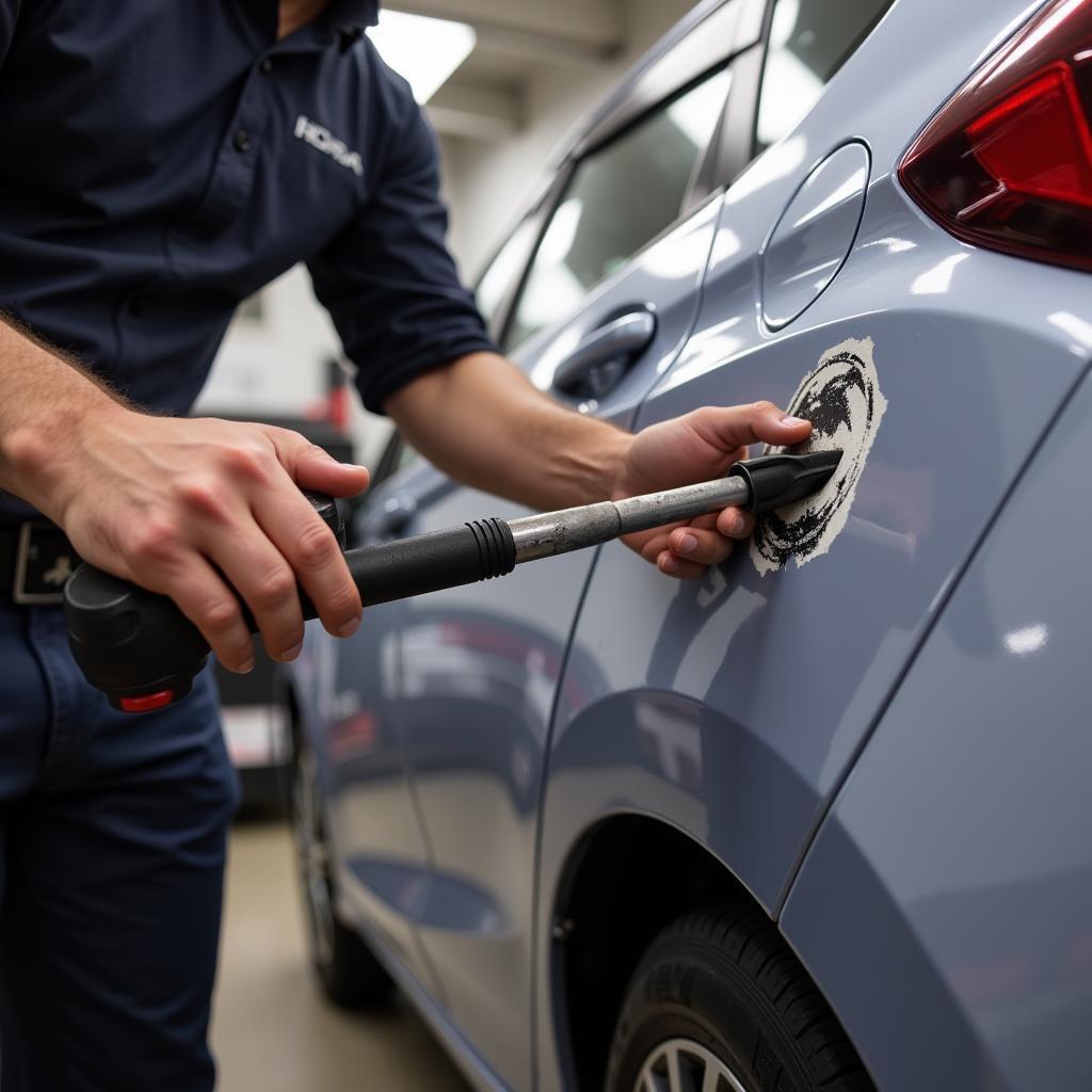 Professional paint repair on a 2016 Honda Fit