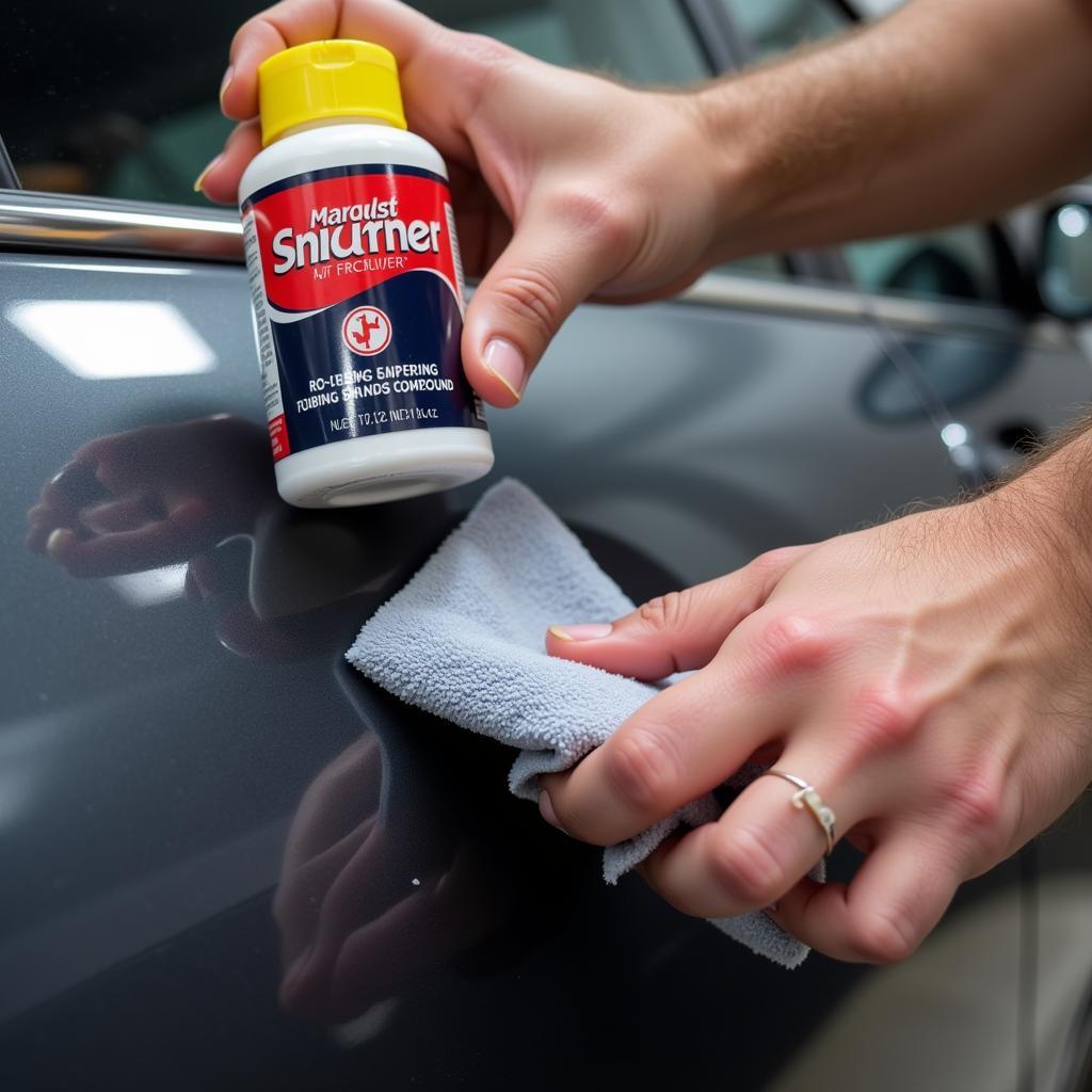 Applying Rubbing Compound to Car Scratch