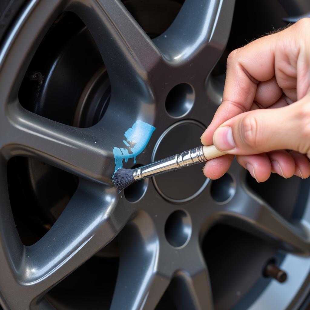 Applying Touch-Up Paint to Car Rim Scratch