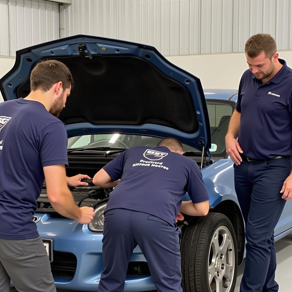 Auckland Car Maintenance Course Students Working on a Car