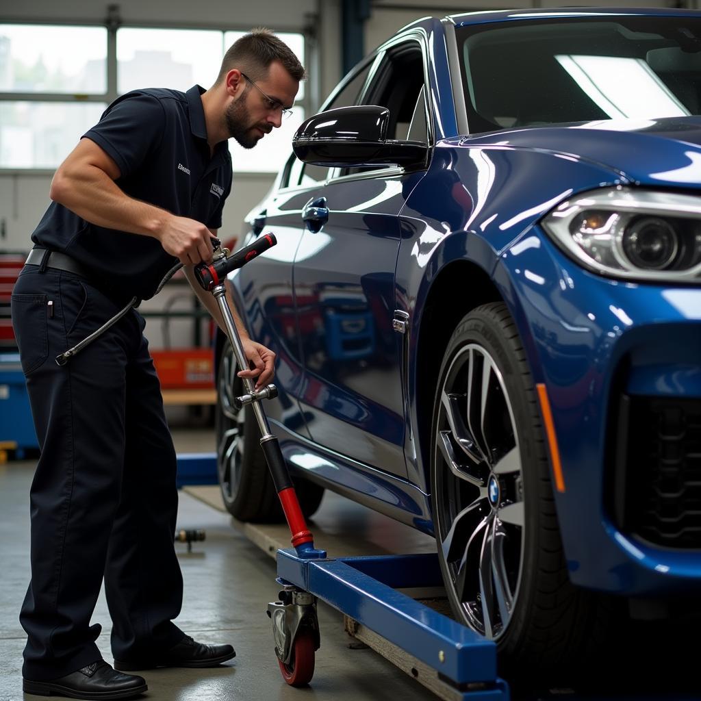 BMW Mechanic Performing 50,000 Mile Service