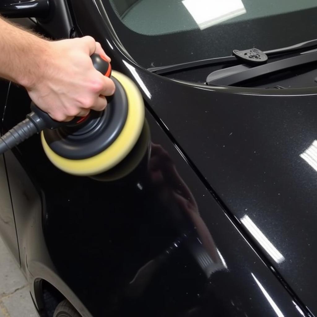 Buffing a black car after scratch repair