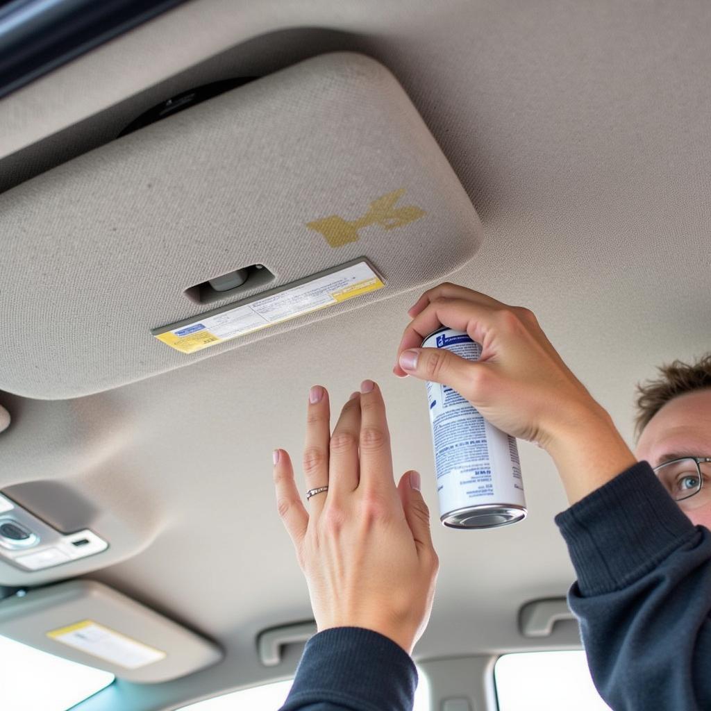 Applying Adhesive Spray to Car Ceiling Fabric