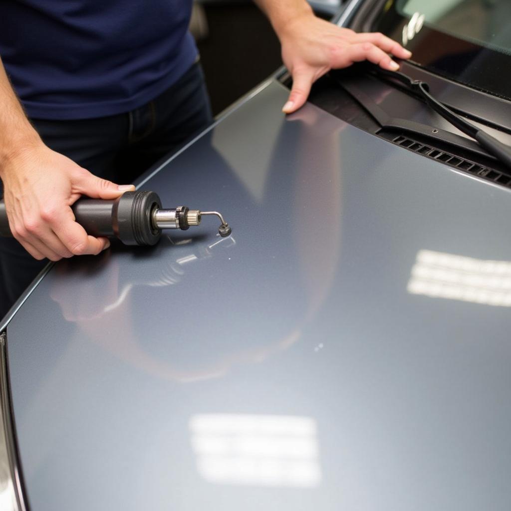 DIY Car Roof Dent Repair Kit in Use