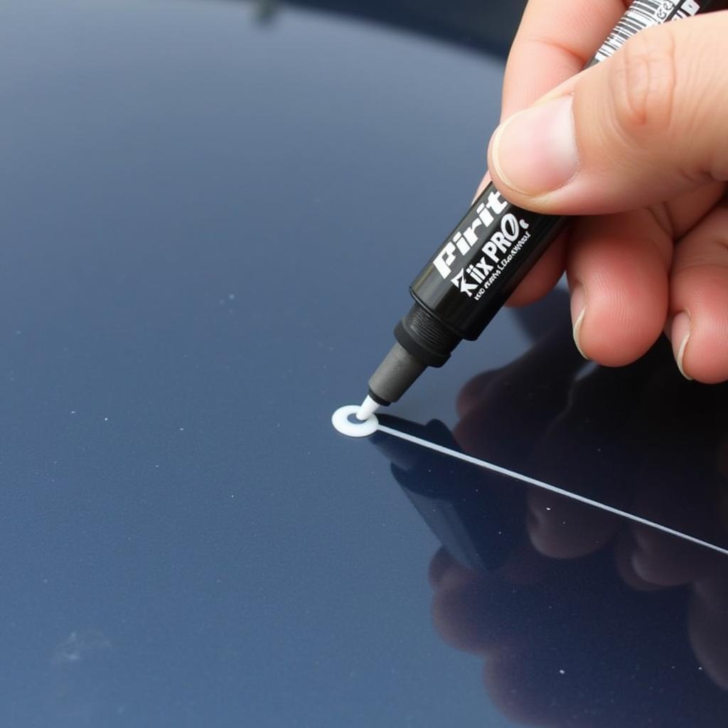 Applying Fix It Pro Car Scratch Repair Pen to a shallow scratch