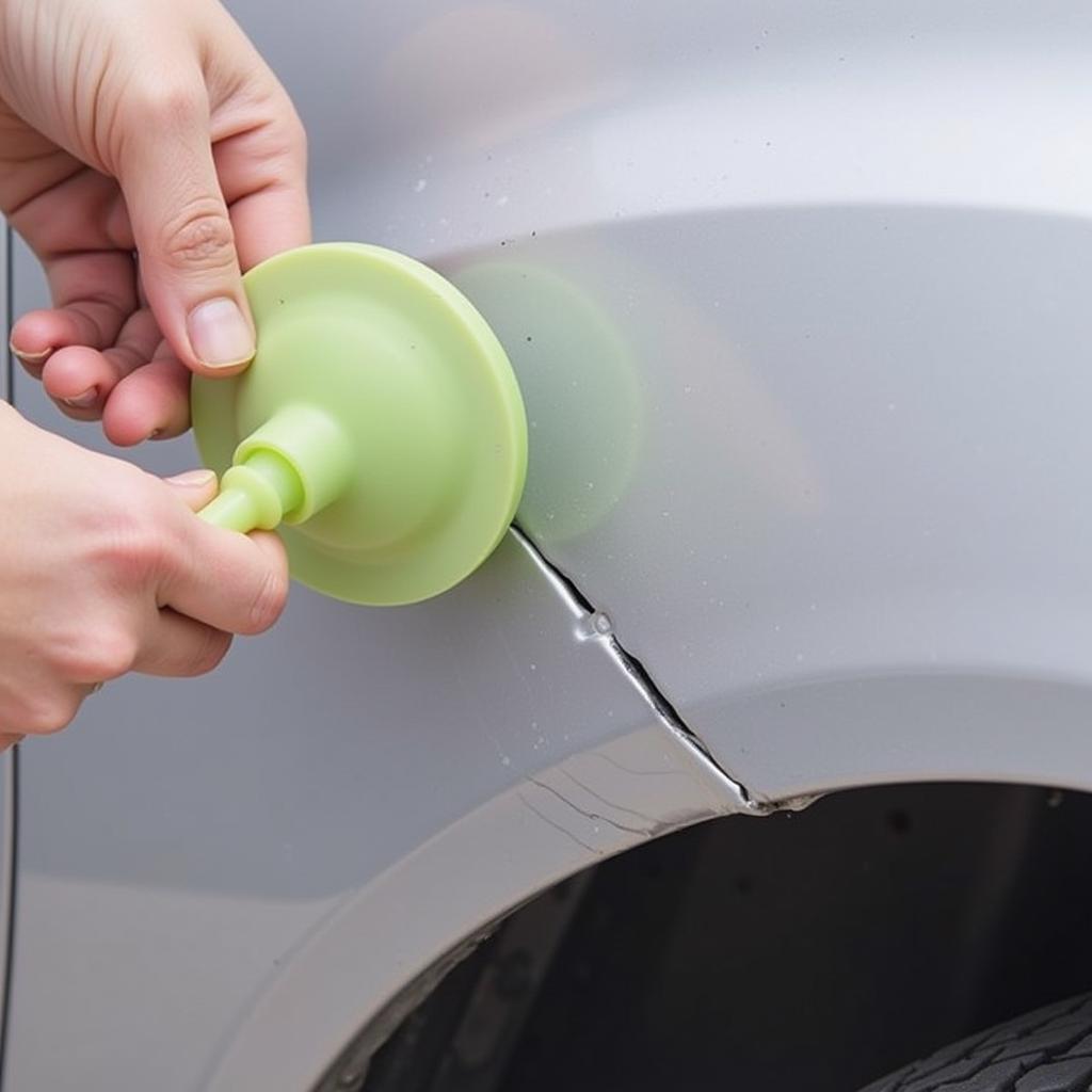 Fixing a Tiny Dent with a Plunger