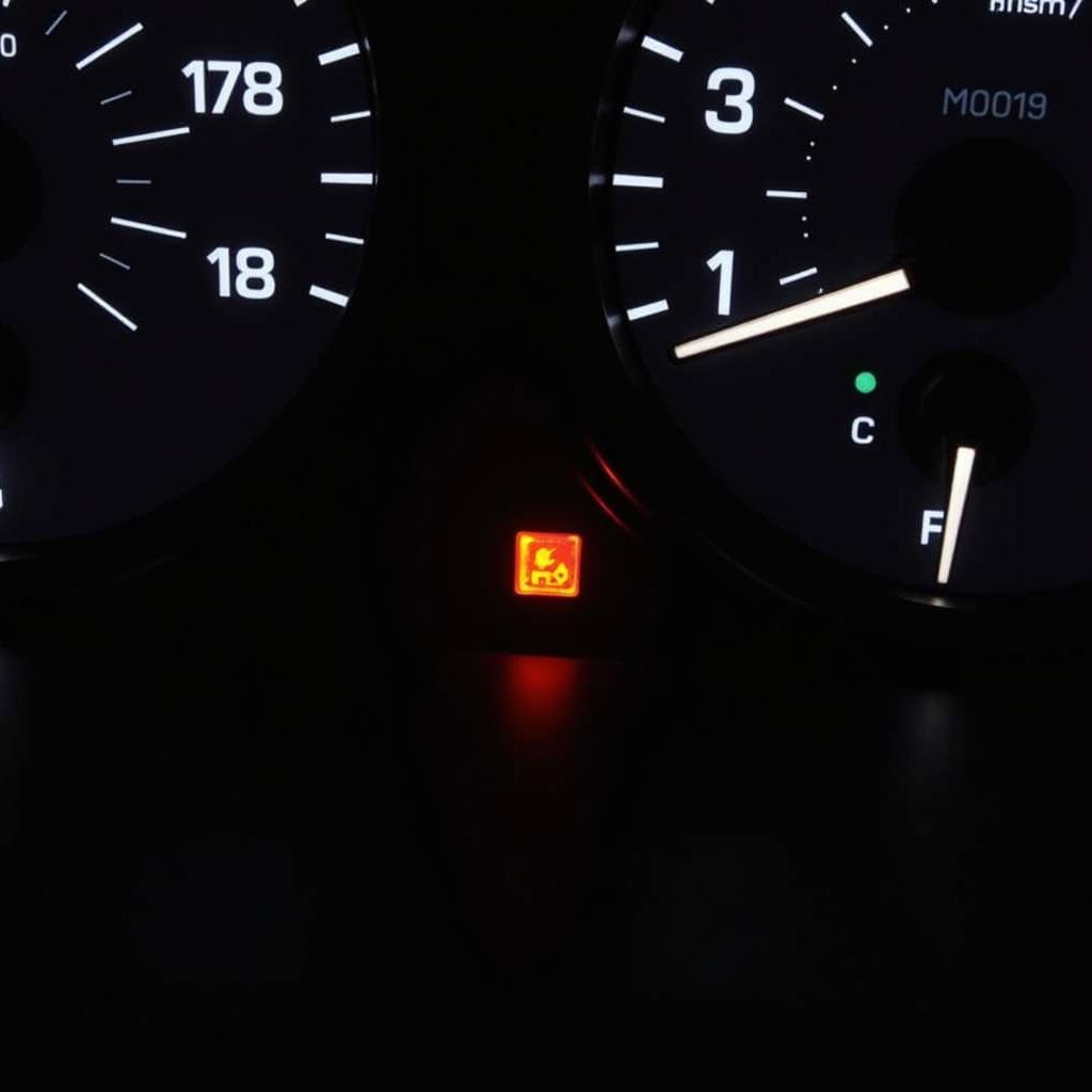 Low Oil Pressure Warning Light on Car Dashboard