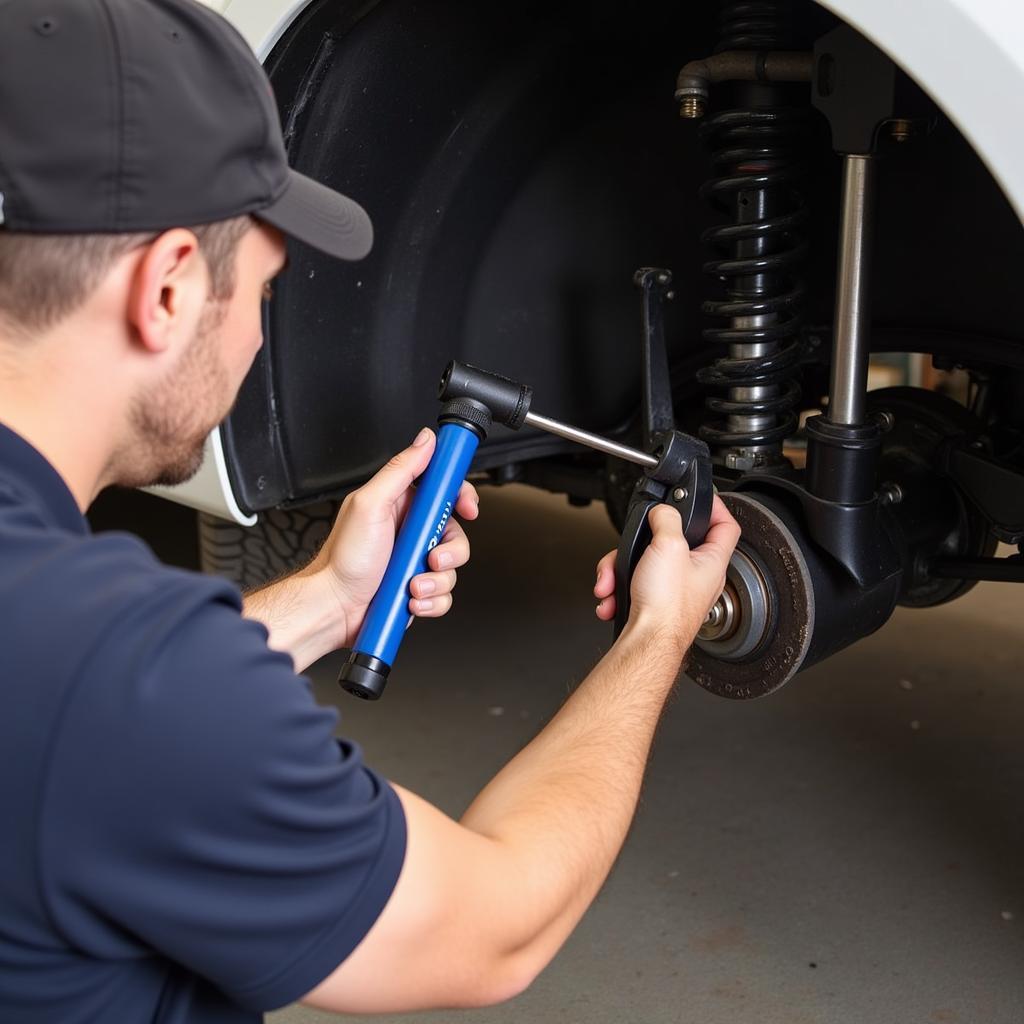 Mechanic inspecting a car's rear suspension