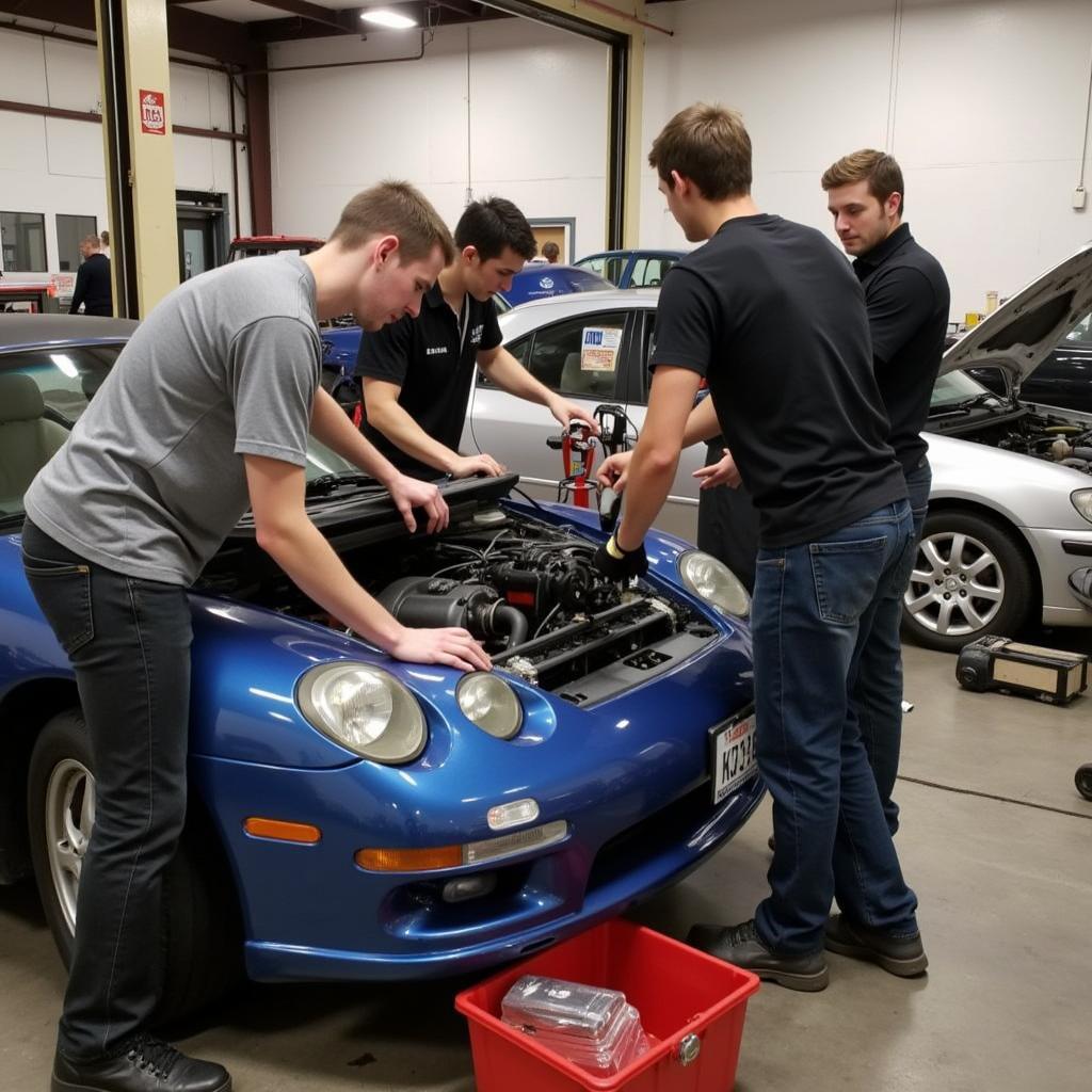 Students Working on a Car Engine at Pasadena City College Automotive Workshop