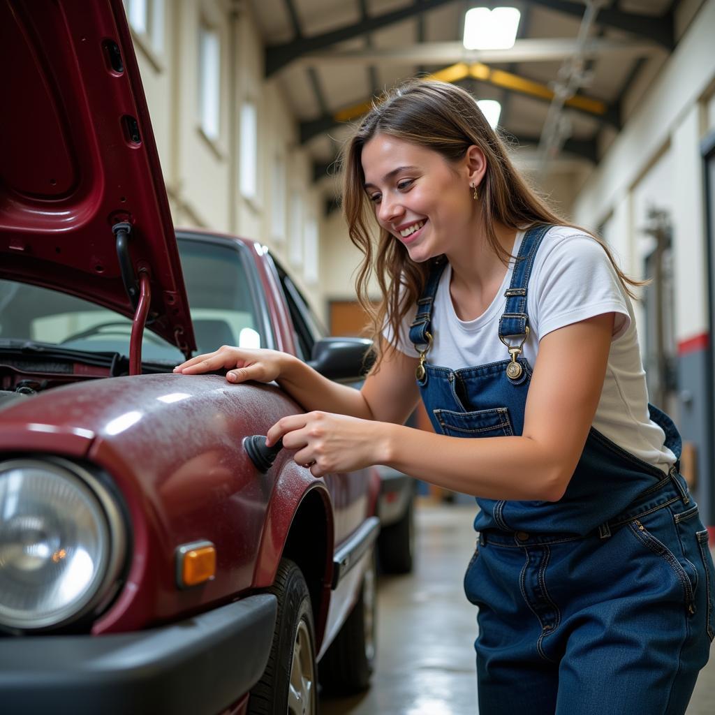 Teen Girl Working on Car