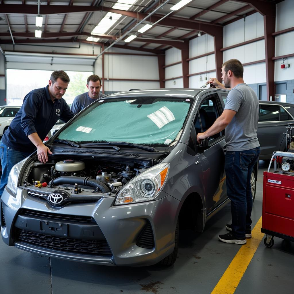 Windshield replacement process in an auto shop