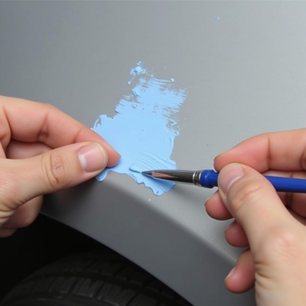 Applying touch-up paint to a car's chipped area