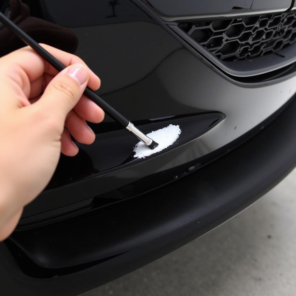 Applying touch-up paint to a car bumper