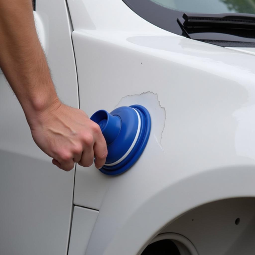 Fixing a Minor Car Dent with a Plunger