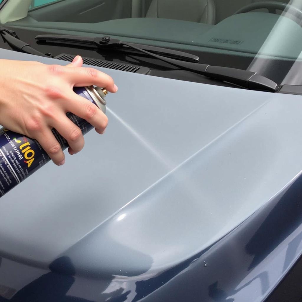 Applying Clear Coat Spray to a Car's Hood